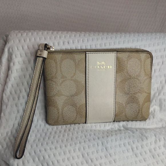 Coach Handbags - Coach Corner Zip Wristlet In Signature Canvas with Central Stripe